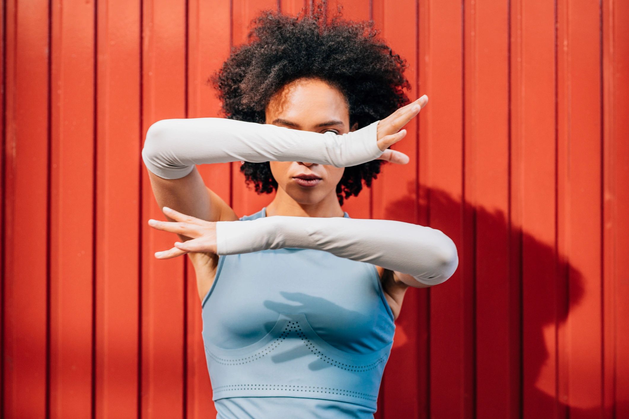 Fit athlete stretching outdoors in performance activewear